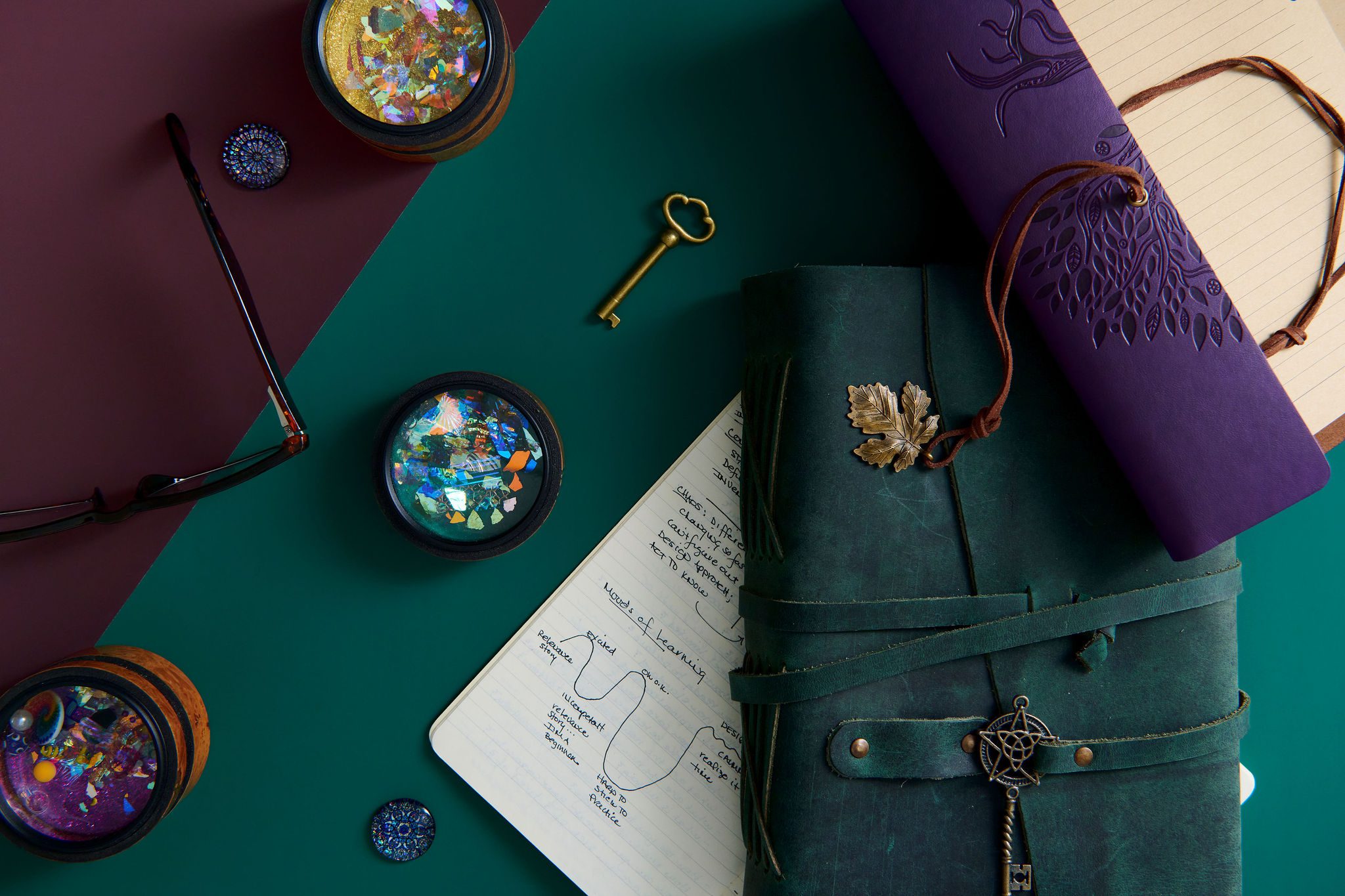 flat lay with notebooks, paper, and key